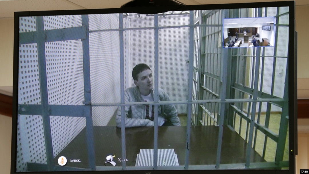 Ukrainian army pilot Nadezhda Savchenko is seen on a monitor during a video link at a hearing in a Moscow court on February 25.