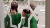 Turkmen schoolgirls at a bus stop in Ashgabat. (illustrative photo)