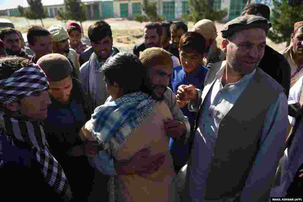 A freed Taliban member hugs relatives after his release from Bagram prison on May 25.