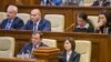 MOLDOVA -- Moldovan Prime Minister Maia Sandu and Andrei Nastase (L) attend a session of parliament in Chisinau, November 12, 2019