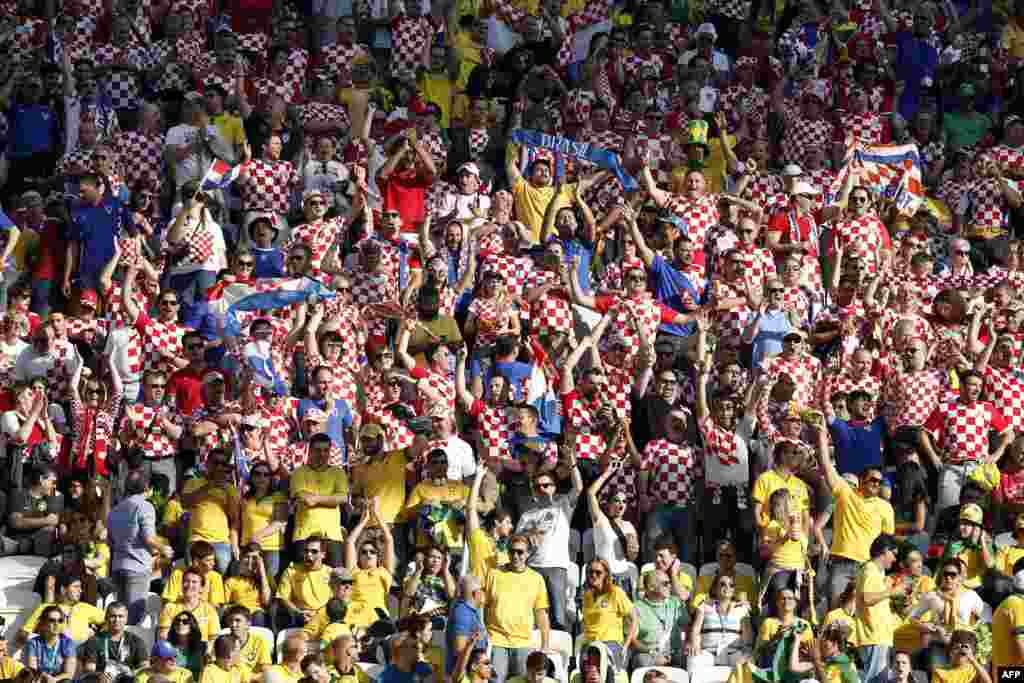 The crowd cheers berfore the Group A match between Brazil and Croatia at the Corinthians Arena in Sao Paulo after the opening ceremony.