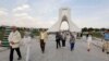 Tourists visit the Azadi Tower in the capital Tehran on April 19, 2018. On April 15, the central bank banned foreign exchange bureaus "until further notice" from buying or selling foreign currency, leaving banks alone to carry out such transactions. But i