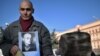 A man holds his father's portrait near a memorial to the victims of Soviet-era political repressions on Lubyanka Square in Moscow on October 29.