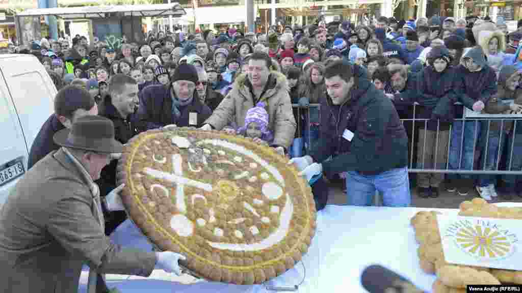 Sharing traditional Christmas bread in downtown Belgrade. Young Tijana Stevanovic found the coin in the bread, signaling good luck in the next year.