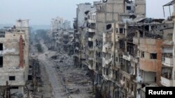 Пошкоджені будинки в сирійському місті Хомс, 27 січня 2014 року