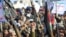 Houthis hold their weapons as they rally in solidarity with Iran and Lebanon, amid the US-Israeli war with Iran, in the Yemeni capital Sanaa on March 27.