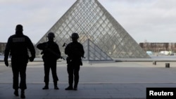 French police secure the site near the Louvre Pyramid in Paris on February 3.