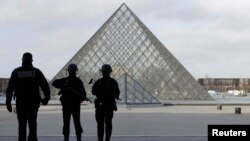 French police secure the site near the Louvre Pyramid in Paris on February 3.