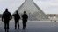 French police secure the site near the Louvre Pyramid in Paris on February 3.