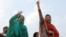 FILEMaryam Nawaz (R), daughter and Kulsoom Nawaz (L) wife of former Pakistan's premier Nawaz Sharif wave to supporters.