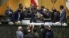 Iranian parliament speaker Ali Larijani, seated at center, talks with a group of lawmakers in a session of parliament in Tehran, Iran, on Dec 02, 2018.