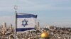 ISRAEL -- An Israeli flag flutters on the roof of a buiding of the Jewish Quarter in the Old City of Jerusalem opposite the Dome of the Rock in the Al-Aqsa mosque compound, December 5, 2017