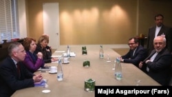 Iranian Foreign Minister Mohammed Javad Zarif (right) meeting with EU foreign policy chief Catherine Ashton (center left) during talks over Iran's nuclear program in Geneva.