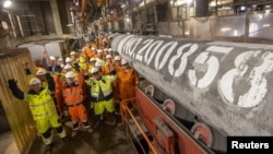 Workers celebrate after finishing the construction of the Nord Stream 2 gas pipeline under the Baltic Sea.