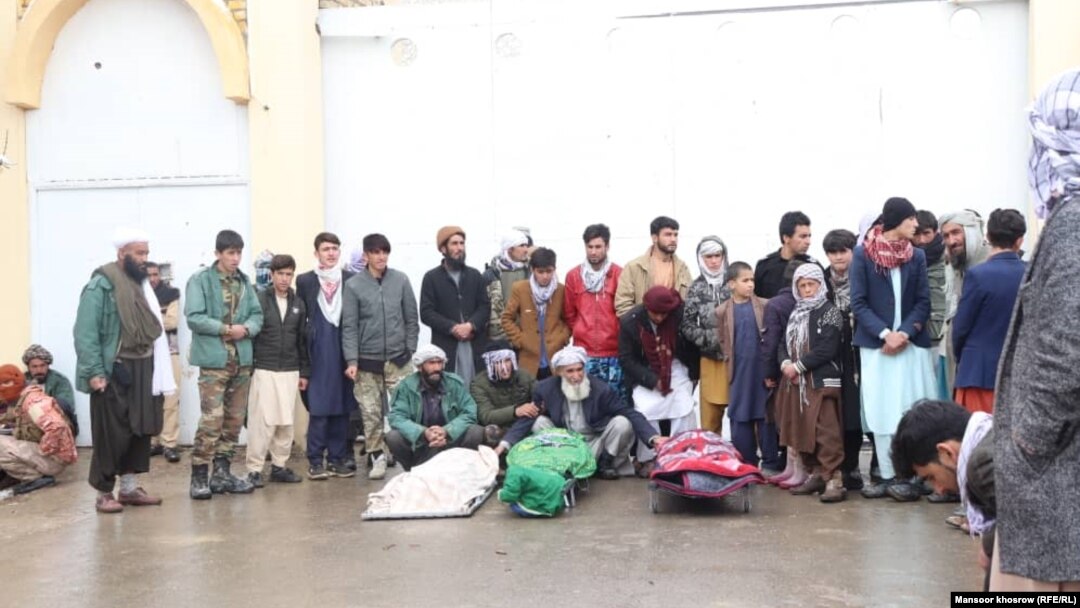 The bodies of Bismillah Adil Aimaq's family members who were killed on the night of February 25 were brought to the Ghor governor's office the following day. 