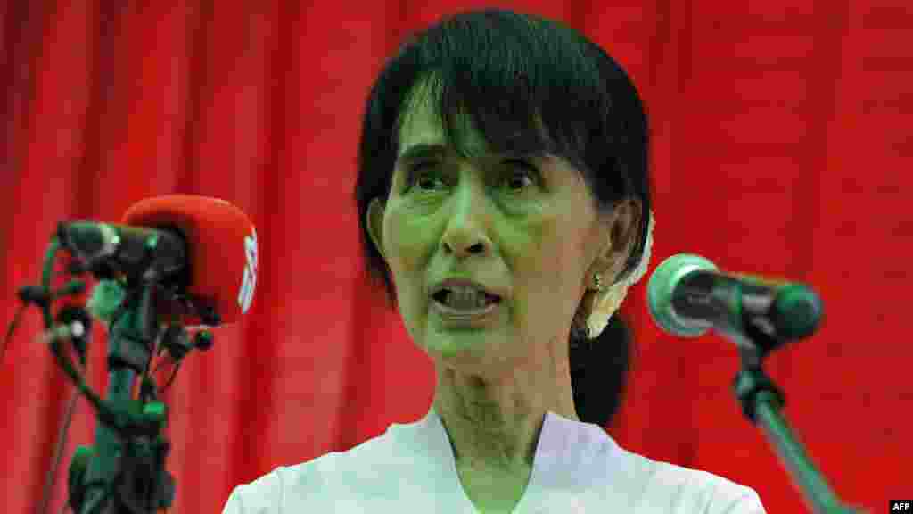 Addressing foreign and local journalists during a press conference held at Suu Kyi's residence in Yangon on March 30, 2012. 