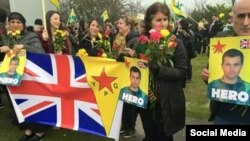 Members of Britain's Kurdish community wait at Manchester Airport on March 20 for Konstandinos "Kosta" Erik Scurfield, a British man who died fighting the Islamic State (IS) group in Syria. 