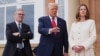 President Donald Trump, center, speaks with the media as he greets Britain's Prime Minister Keir Starmer, left, and his wife Victoria in Turnberry, Scotland.