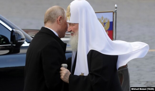 Володимир Путін (зліва) і Кирило