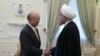 IRAN -- A handout photo made available by the presidential official website shows, Iranian President Hassan Rouhani (R) greeting Director General of the International Atomic Energy Agency (IAEA) Yukiya Amano (L), at the presidential office in Tehran, Ira