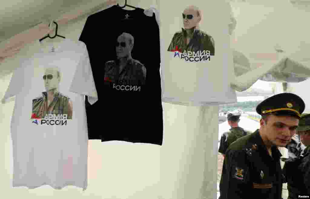 T-shirts, displaying images of Russian President Vladimir Putin go on sale at a canteen during an event entitled "Innovations Day," which was organized by Russia's Western military command at the Levashovo airbase outside St. Petersburg on June 6. (Reuters/Alexander Demianchuk)