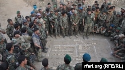 FILE: Afghan National Army soldiers planning an operation against militants in Kunduz.