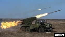 Russian soldiers fire a BM-21 Grad multiple rocket launcher system during military exercises in 2019, three years before the Ukraine invasion.