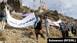 Members of the Afghan women's "Coalition Against Corruption" gather for a protest on Kabul's Antenna Mountain, 5Dec2012
