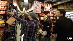 People navigate the aisles of a Whole Foods Market in midtown New York on October 28, as residents stocked up on food and other items in preparation for Hurricane Sandy.