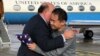 U.S. Ambassador to Switzerland Edward T. McMullen, Jr. (left) welcomes Xiyue Wang on arrival in Switzerland after his release from Iranian captivity on December 7.