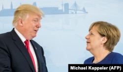 German Chancellor Angela Merkel (right) and U.S. President Donald Trump speak prior to a bilateral meeting on the eve of the G20 summit in Hamburg on July 6.