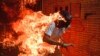 VENEZUELA - demonstrator catching fire during clashes with riot police within a protest against Venezuelan President Nicolas Maduro in Caracas. May 3, 2017 