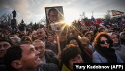 Supporters of Vladimir Putin gather for a rally to celebrate the fourth anniversary of Russia's annexation of Crimea in Sevastopol earlier this year.