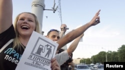 Protesters take part in a rally against a rise in gasoline prices in Minsk in June.