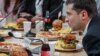 President Volodymyr Zelenskiy holds a marathon press event at a food market in Kyiv on October 10. 