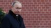 RUSSIA -- Russian President Vladimir Putin reacts during a wreath laying ceremony at the Tomb of the Unknown Soldier by the Kremlin wall to mark the Defender of the Fatherland Day in Moscow on February 23, 2019