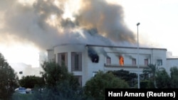 Smoke rises from headquarters of Libya's Foreign Ministry in Tripoli after it was attacked on December 25. 