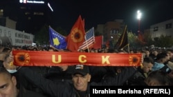 People celebrate in Pristina after parliament passed legislation limiting the decisions of a Hague-based war crimes court on October 6. The EU has expressed "deep concern" over the amendment.