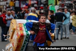 Migrant laborers work at a market in Moscow.