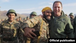 Armenia -- An Armenian army reservist takes a selfie with Defense Minister Davit Tonoyan (R) during a military exercise, September 30, 2019.