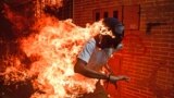 VENEZUELA - demonstrator catching fire during clashes with riot police within a protest against Venezuelan President Nicolas Maduro in Caracas. May 3, 2017 