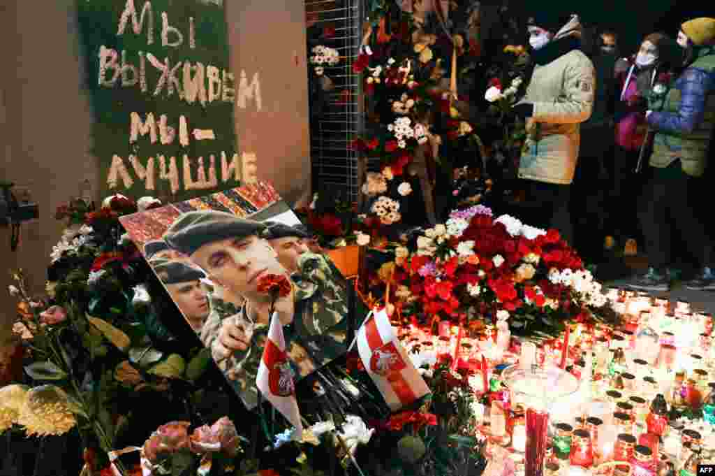 Mourners lay flowers at the impromptu shrine to Bandarenko below the graffiti reading: &quot;&quot;We will survive, we are the best.&quot;&nbsp;