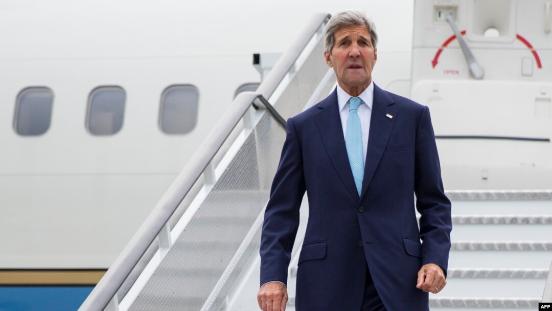 U.S. Secretary of State John Kerry arrives at London's Stansted Airport on September 18.