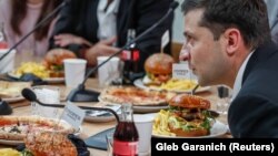 President Volodymyr Zelenskiy holds a marathon press event at a food market in Kyiv on October 10. 