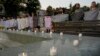 People attend a vigil to mark the 28th anniversary of the Srebrenica massacre in Belgrade on July 11.