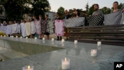 People attend a vigil to mark the 28th anniversary of the Srebrenica massacre in Belgrade on July 11.