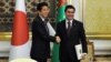 Turkmen President Gurbanguly Berdymukhamedov (right) shakes hands with Japanese Prime Minister Shinzo Abe following their meeting in Ashgabat on October 23. 