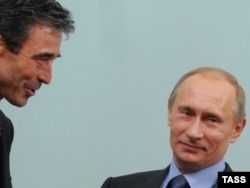 Then-Russian Prime Minister Vladimir Putin meets with NATO Secretary-General Anders Fogh Rasmussen in Moscow on December 16, 2009.