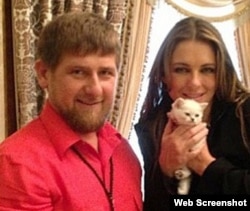 Kadyrov and Hurley pose with a kitten on Kadyrov's Instagram account.