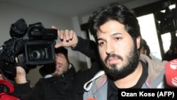 Reza Zarrab, a dual citizen of Turkey and his native Iran, is surrounded by journalists as he arrives at a police center in Istanbul in December 2013. Will his U.S. trial expose facts Turkey's president would rather not be made public?